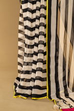 Load image into Gallery viewer, Black &amp; White georgette sequence Saree paired with Embroidered sleeveless blouse
