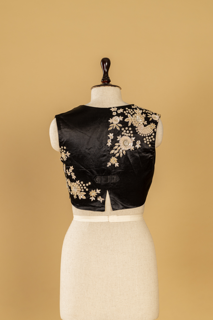 Black & White georgette sequence Saree paired with Embroidered sleeveless blouse