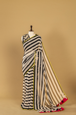 Load image into Gallery viewer, Black &amp; White georgette sequence Saree paired with Embroidered sleeveless blouse

