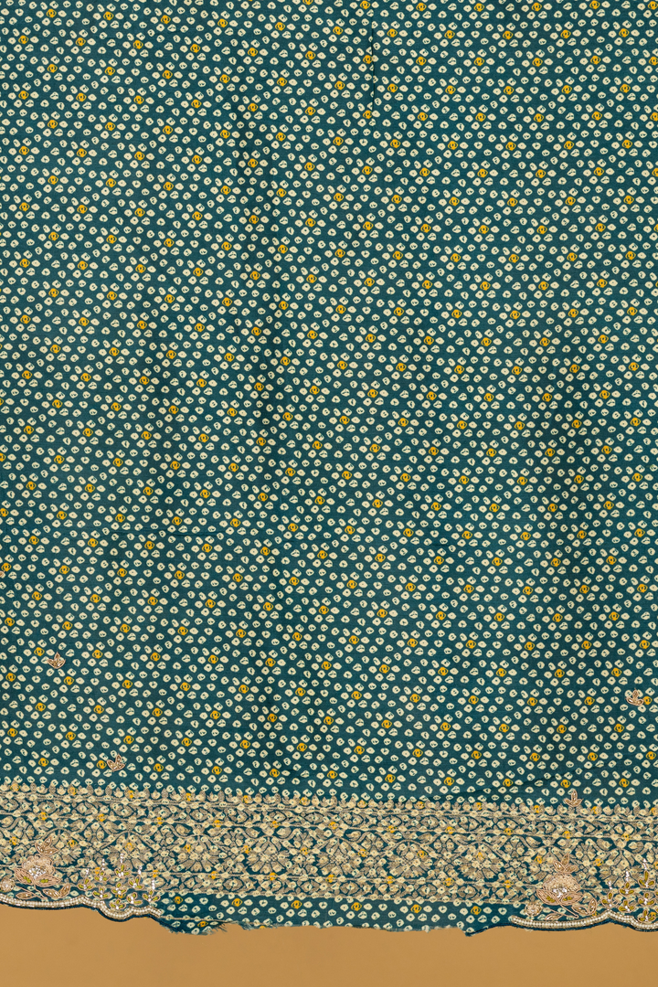 Blue & green ombrae banarasi bandhej with border highlighted  paired with unstitched blouse