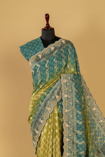 Load image into Gallery viewer, Blue &amp; green ombrae banarasi bandhej with border highlighted  paired with unstitched blouse
