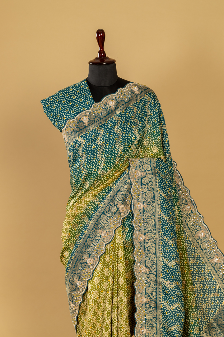 Blue & green ombrae banarasi bandhej with border highlighted  paired with unstitched blouse
