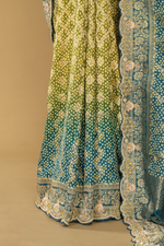 Load image into Gallery viewer, Blue &amp; green ombrae banarasi bandhej with border highlighted  paired with unstitched blouse
