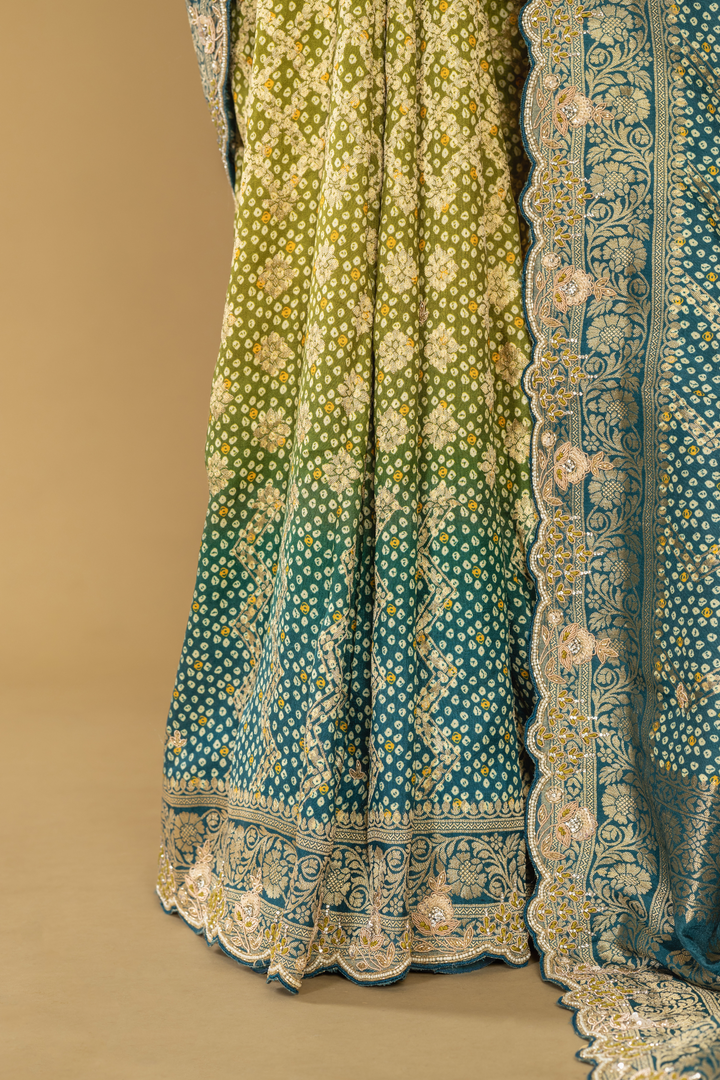 Blue & green ombrae banarasi bandhej with border highlighted  paired with unstitched blouse