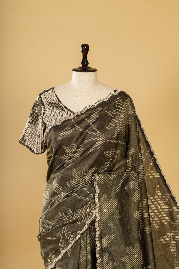 Carbon green bandhej tissue scallop border saree paired with heavy blouse