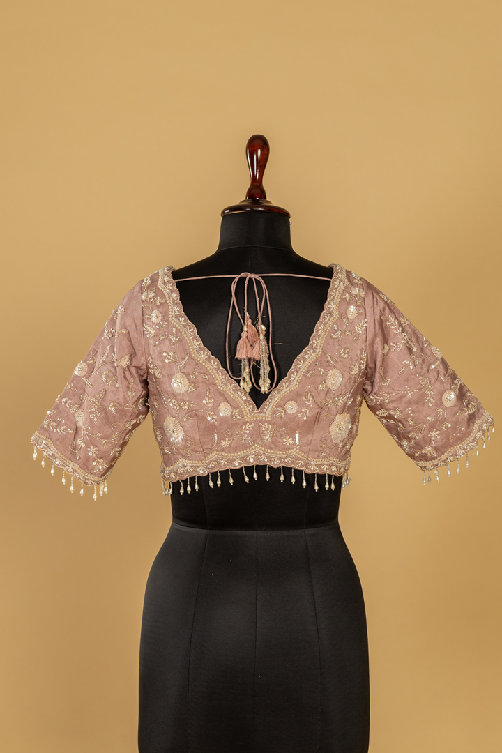 Chickoo Tissue sequence embroidered saree paired with elbow sleeves blouse