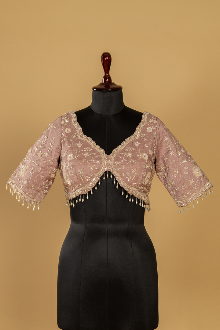 Chickoo Tissue sequence embroidered saree paired with elbow sleeves blouse