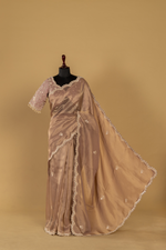 Load image into Gallery viewer, Chickoo Tissue sequence embroidered saree paired with elbow sleeves blouse
