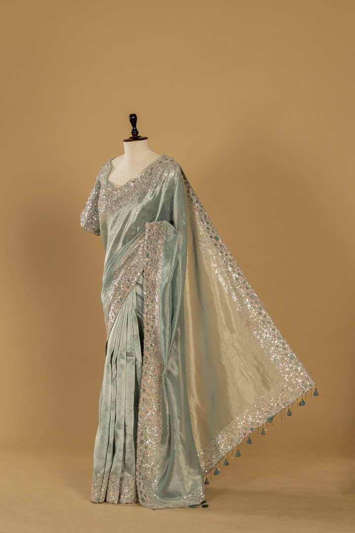 Greyish Blue Zari tissue sequence saree paired with stitched blouse