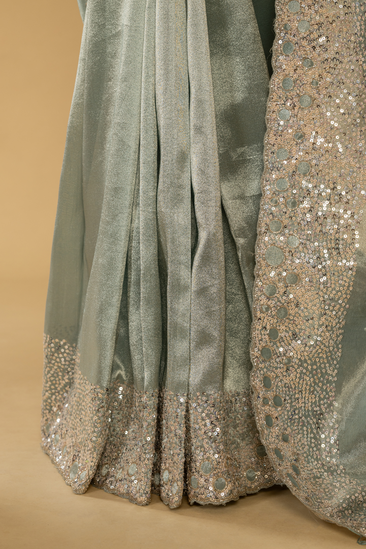 Greyish Blue Zari tissue sequence saree paired with stitched blouse