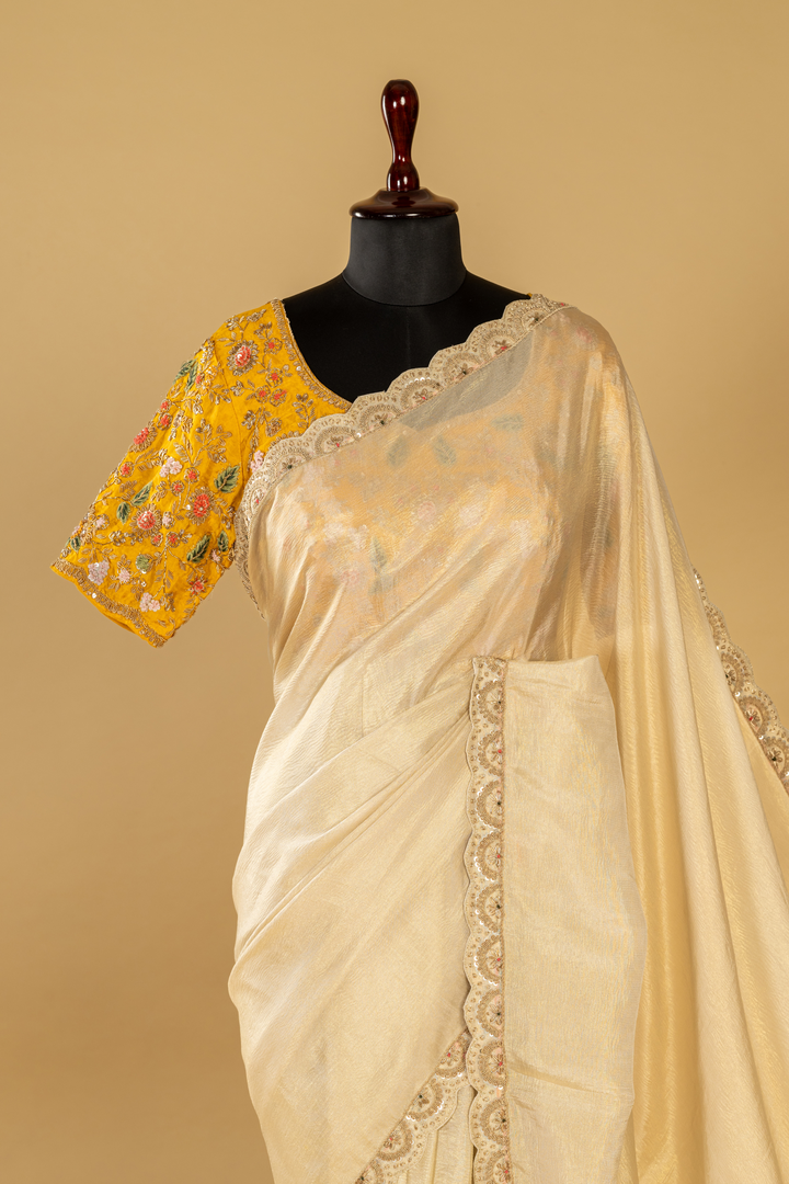 Ivory crush tissue resham & zardosi embroidered saree paired with  yellow blouse