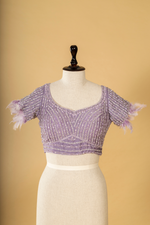 Load image into Gallery viewer, Lilac Tissue embroidered saree paired with feather detailing blouse
