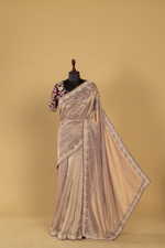 Load image into Gallery viewer, Mauve Crushed Tissue heavy embroidered saree paired with purple blouse
