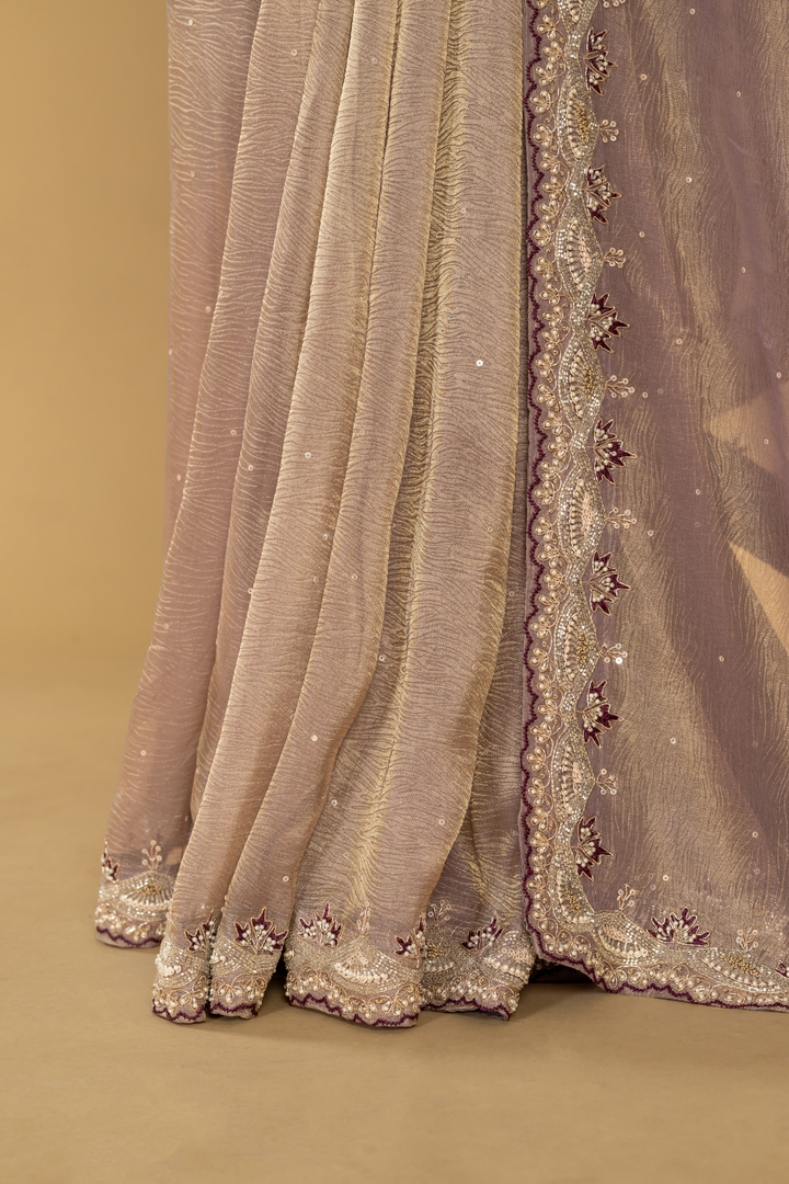 Mauve Crushed Tissue heavy embroidered saree paired with purple blouse