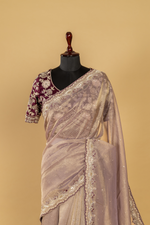 Load image into Gallery viewer, Mauve Crushed Tissue heavy embroidered saree paired with purple blouse
