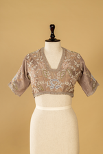Load image into Gallery viewer, Mauve tissue embroidered saree paired with stitched blouse
