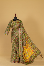 Load image into Gallery viewer, Mustard Ajrak print saree with embroidery highlightment paired with full sleeves blouse
