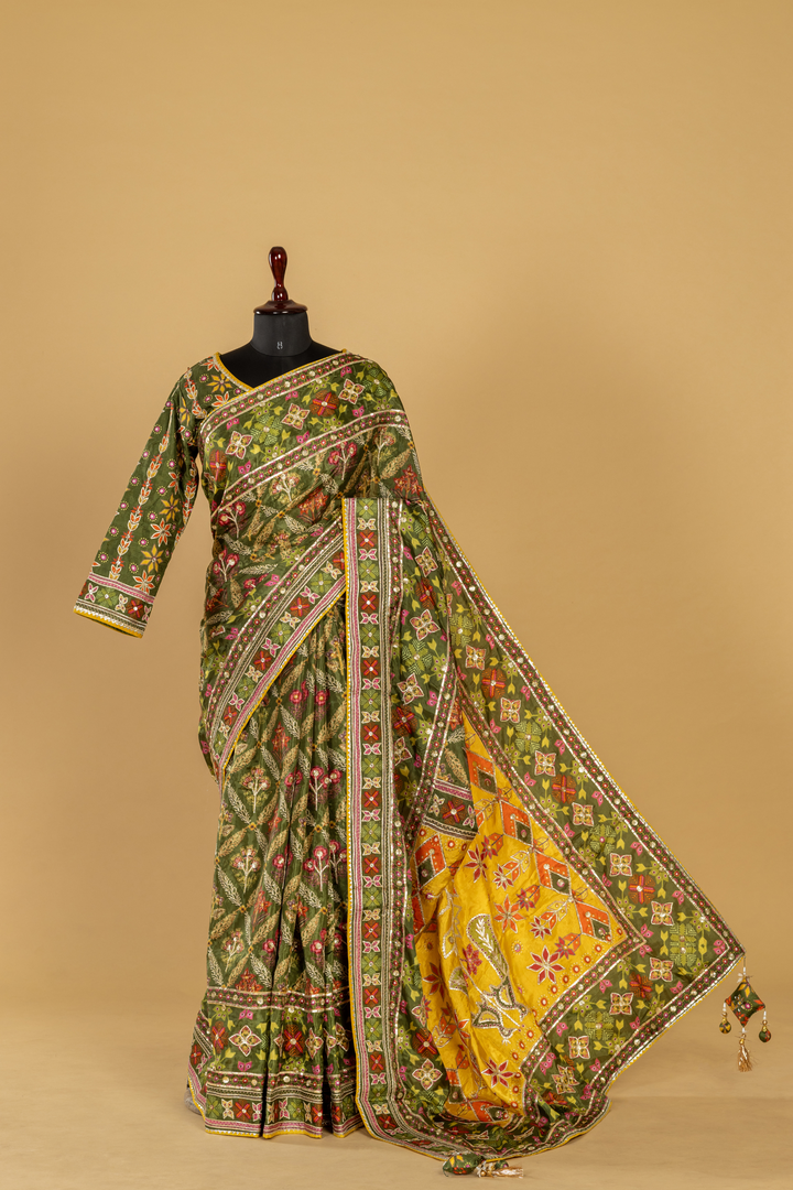 Mustard Ajrak print saree with embroidery highlightment paired with full sleeves blouse