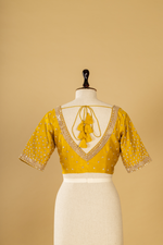 Load image into Gallery viewer, Mustard silk printed border highlighted saree paired with elbow sleeves blouse
