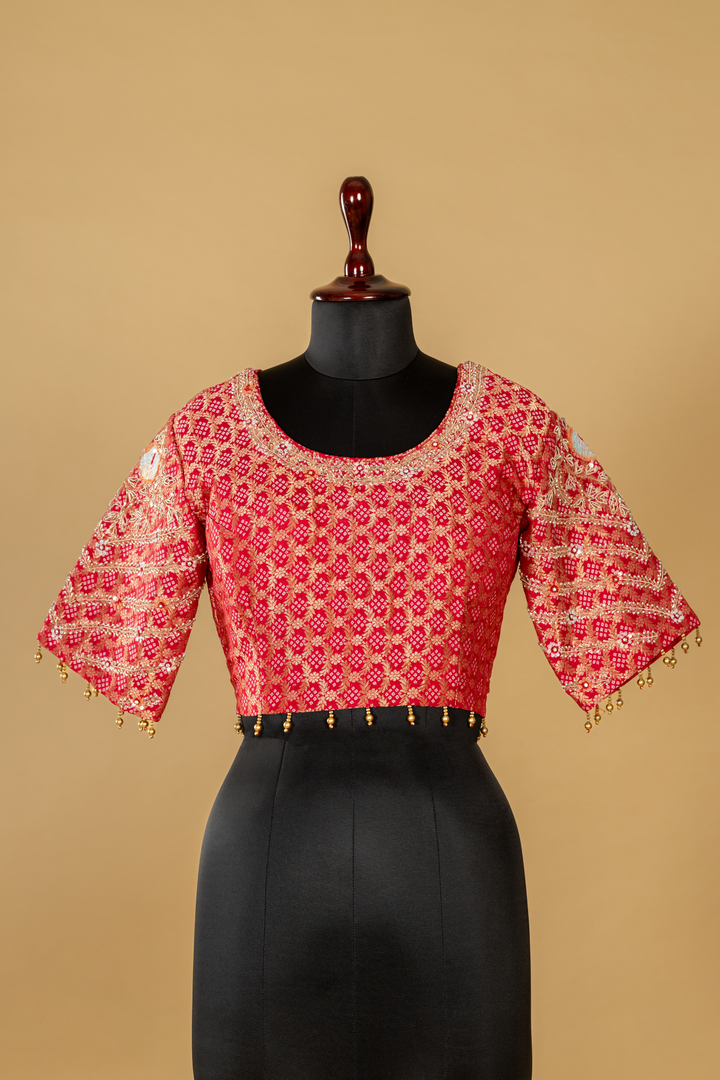 Onion peach tissue saree paired with pink bandhej upada blouse