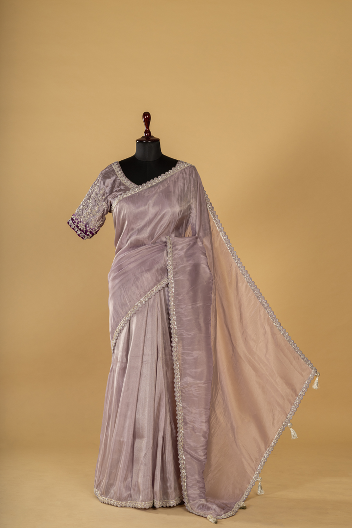 Purple georgette tissue saree paired with stitched embroidered saree