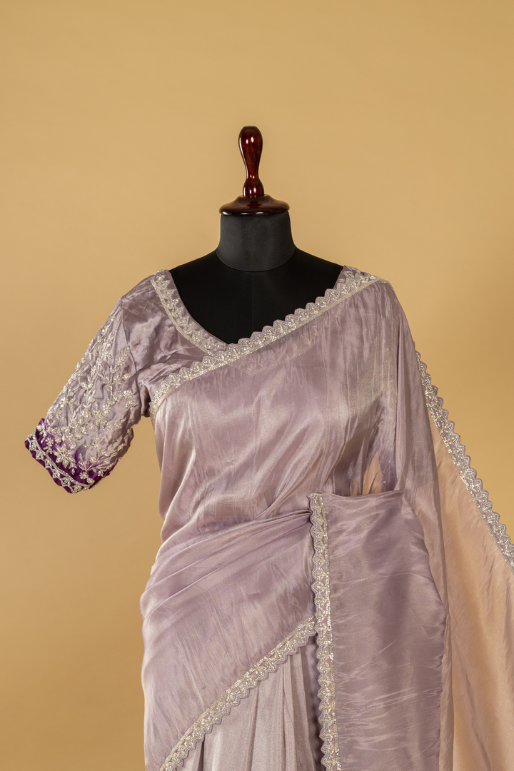 Purple georgette tissue saree paired with stitched embroidered saree