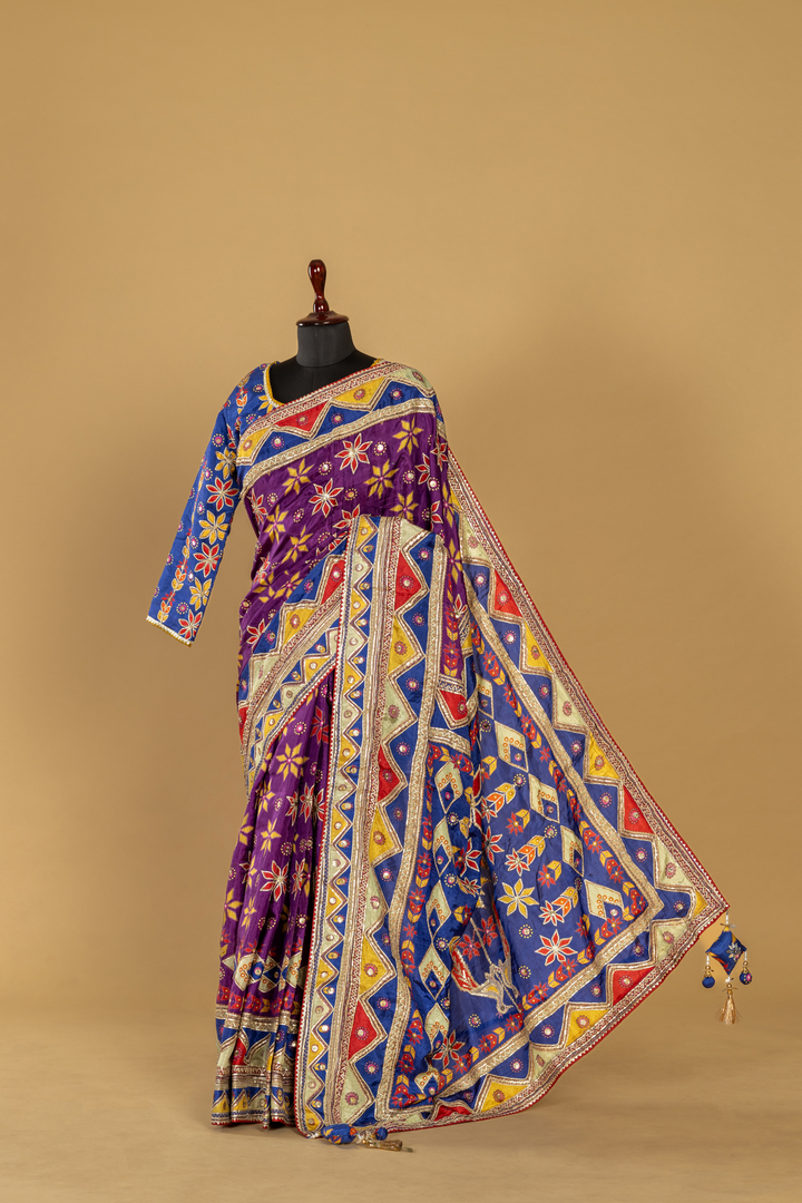 Purple printed saree with gota work highlightment paired with full sleeves contrast blouse