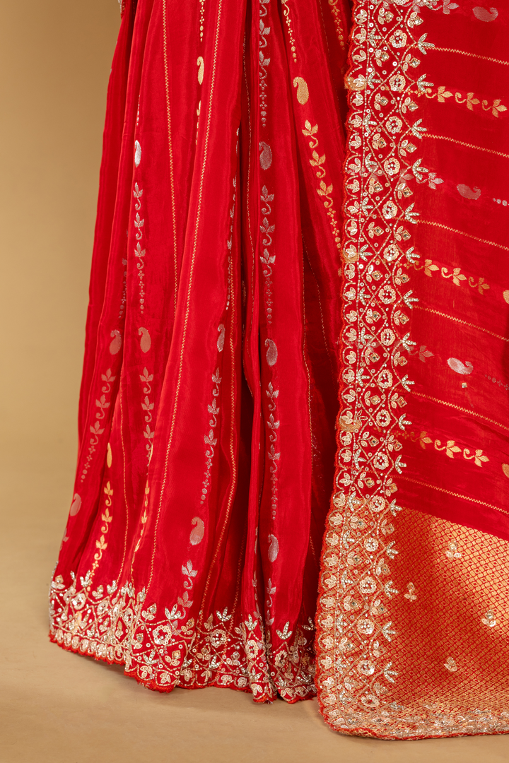 Red Banarasi Embroidered saree paired with unstitched blouse