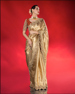 Load image into Gallery viewer, Exude ethereal elegance in this fluid gold tissue Saree