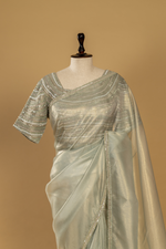Load image into Gallery viewer, Sea green tissue sequence embroidery saree paired with embroidered stitched blouse
