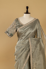 Load image into Gallery viewer, Steel grey georgette tissue saree paired with border ombrae embroidery blouse
