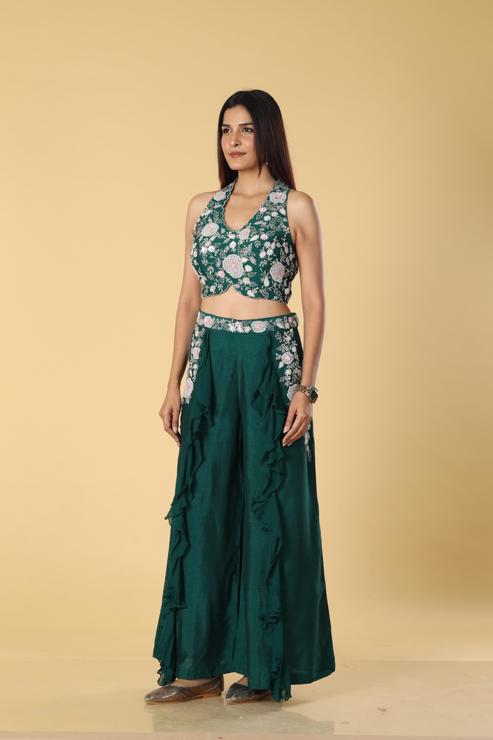 Green D-dupion georgette ruffle palazzo paired with embroidered halter neck blouse