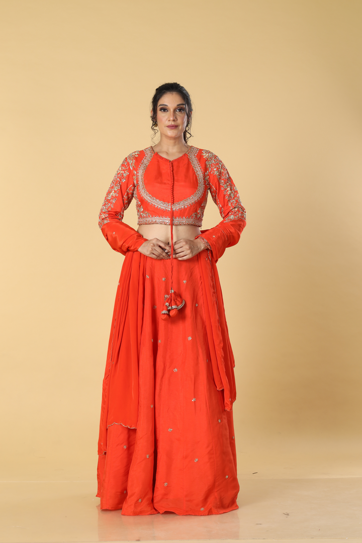 Orange   upada silk embroidered lehenga paired with designer blouse and crepe dupatta