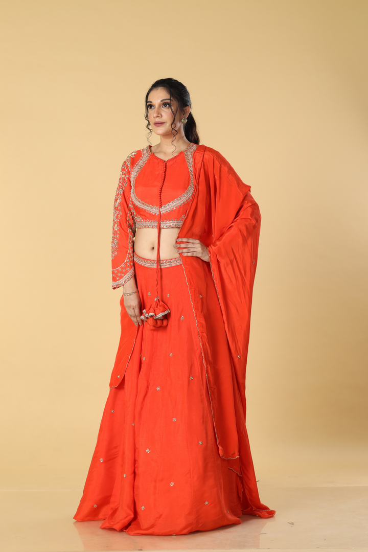 Orange   upada silk embroidered lehenga paired with designer blouse and crepe dupatta