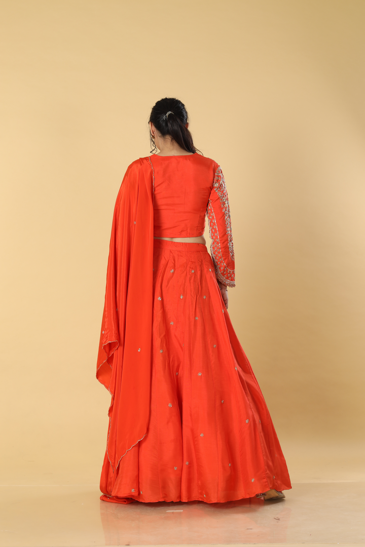 Orange   upada silk embroidered lehenga paired with designer blouse and crepe dupatta