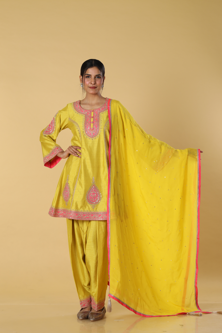 Yellow d-dupion dhoti style paired with peplum embroidered kurta and dupatta