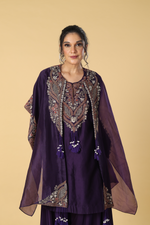 Load image into Gallery viewer, Purple resham dori embroidered suit paired with modal satin dhoti style bottam and organza cape
