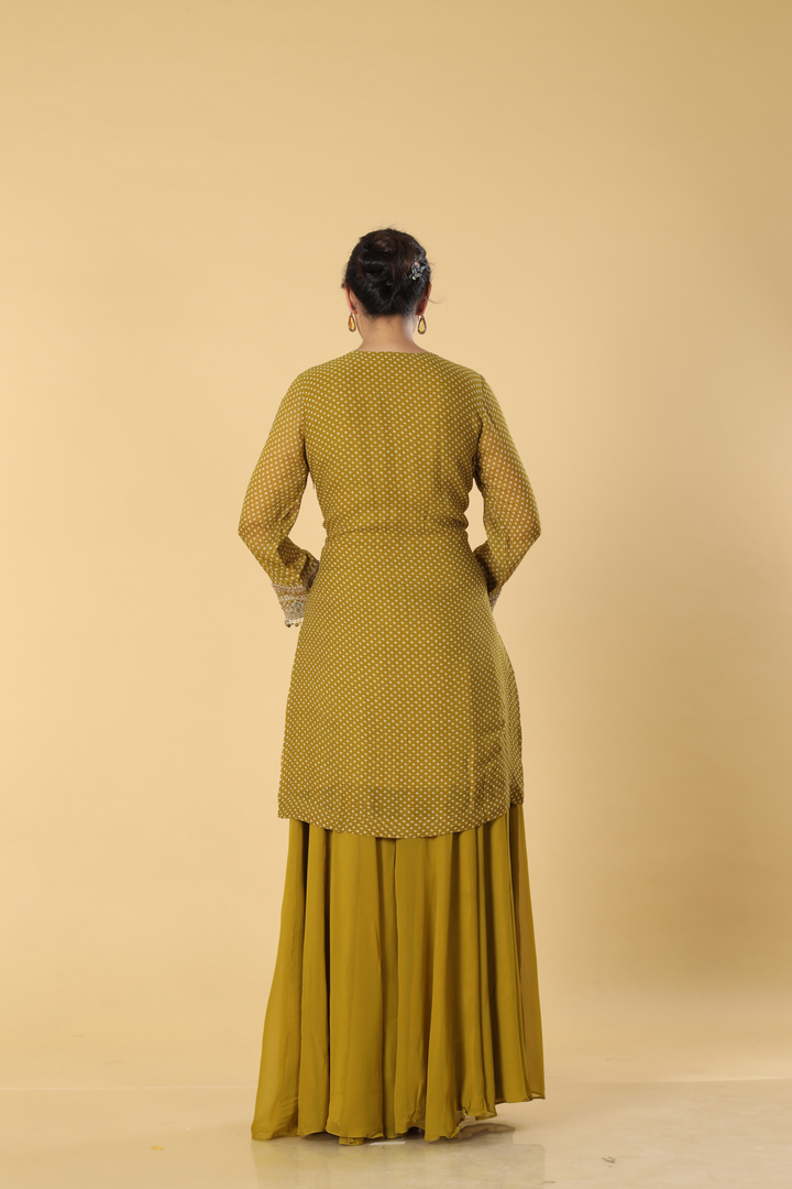 Apple green bandhej dori embroidered suit paired with georgette sharara and tissue dupatta