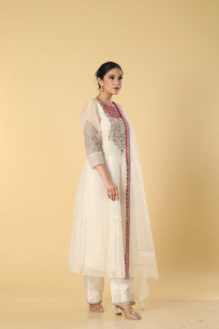 Off white pure chanderi sik dori embroidered dress paired with dola silk pants and organza dupatta