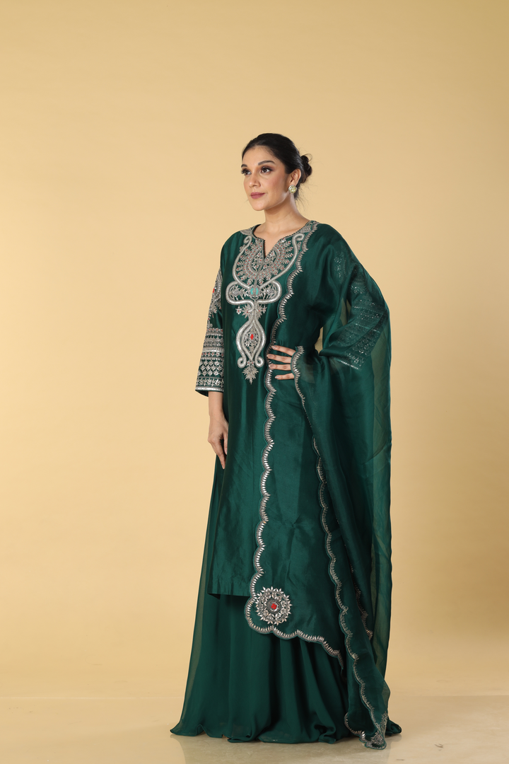 Royal green chanderi silk dori resham embroidery paired with georgette sharara and organza dupatta