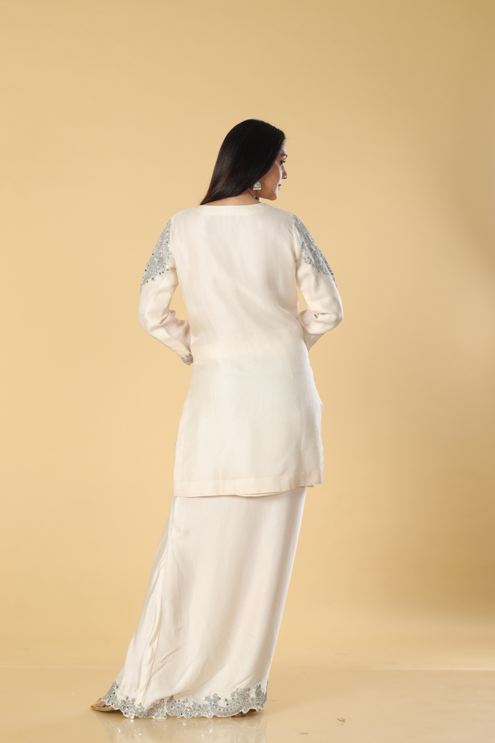 Off white banarasi organza mirror & resham embroidered suit paired with cowl skirt