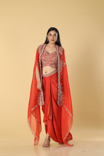 Load image into Gallery viewer, Burnt orange modal satin tulip skirt paired with embroidered blouse and organza cape
