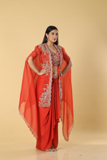 Load image into Gallery viewer, Burnt orange modal satin tulip skirt paired with embroidered blouse and organza cape
