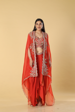 Load image into Gallery viewer, Burnt orange modal satin tulip skirt paired with embroidered blouse and organza cape
