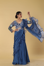 Load image into Gallery viewer, Blue raw silk multicolour resham embroidered blouse paired with chinnon drape &amp; crepe skirt
