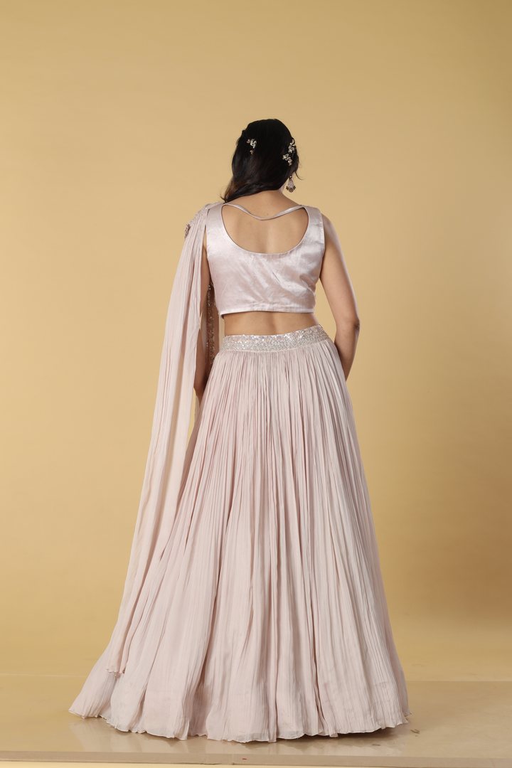 Dusting Pink chinnon skirt paired with embroidered drape and blouse