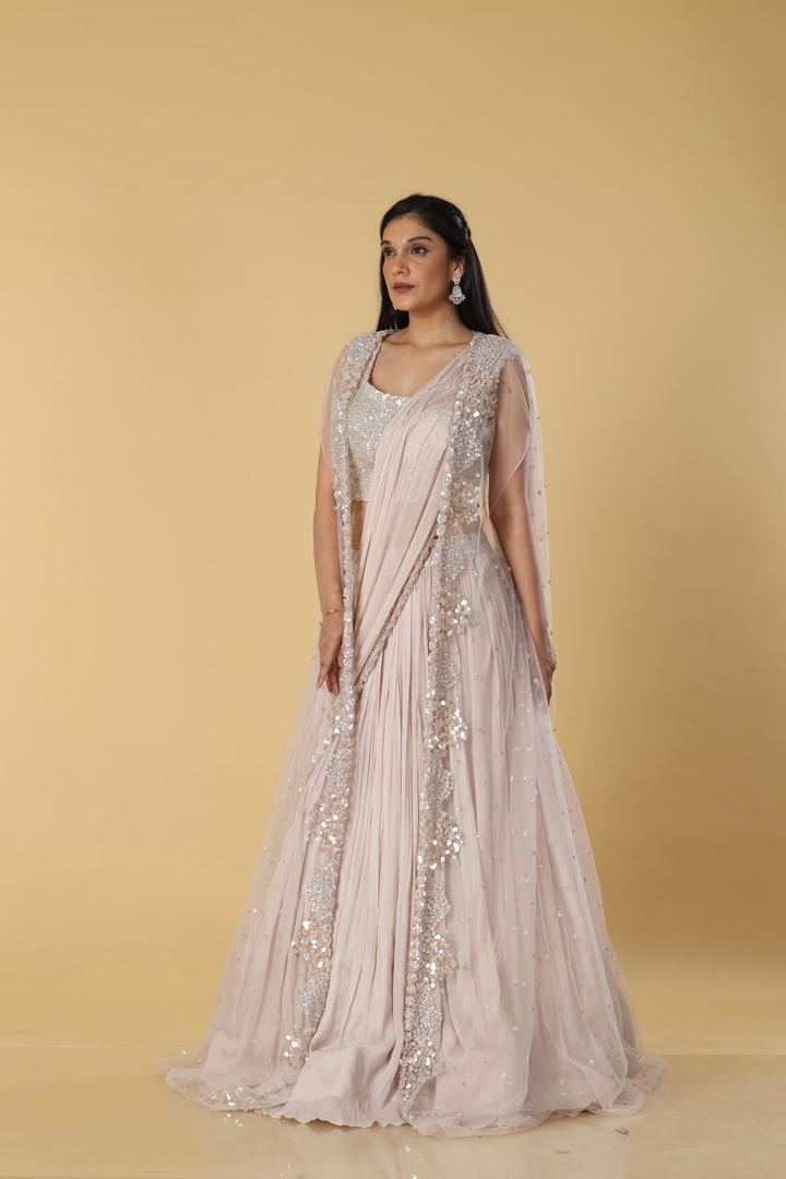Dusty Pink Chinnon skirt paired with drape , blouse and net long jacket