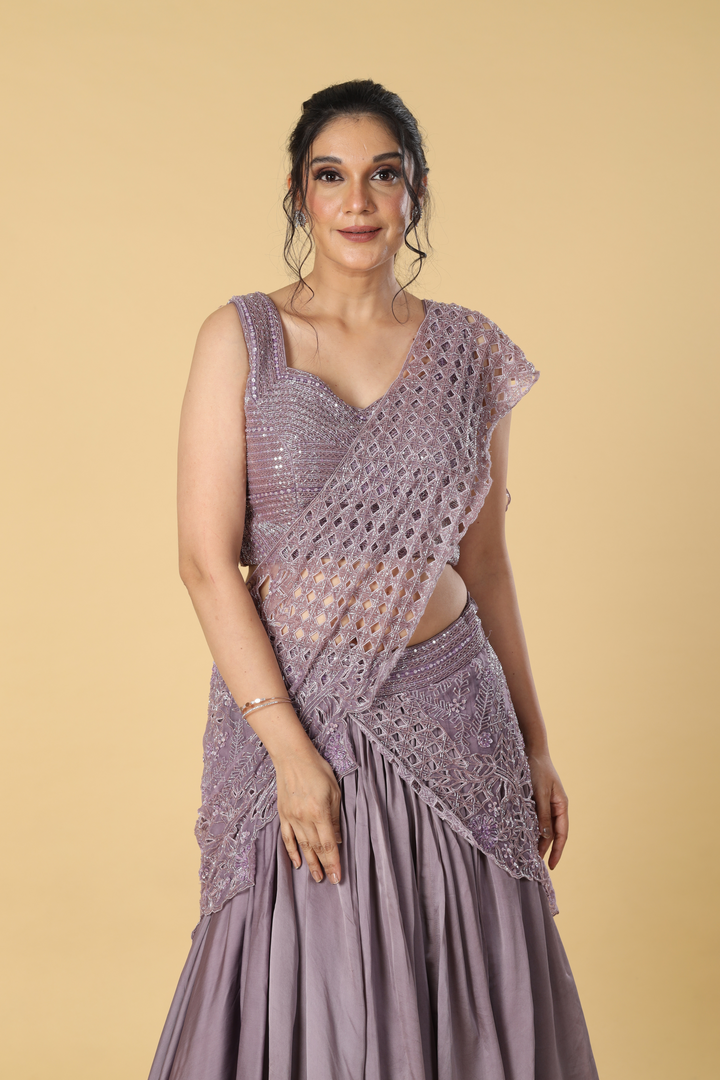 Purple organza cut work embroidered blouse & drape paired with satin organza layered skirt