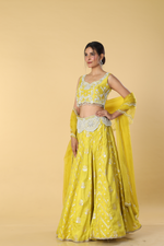 Load image into Gallery viewer, Yellow banarasi lehenga with broad belt paired with raw silk embroidered blouse  and organza dupatta
