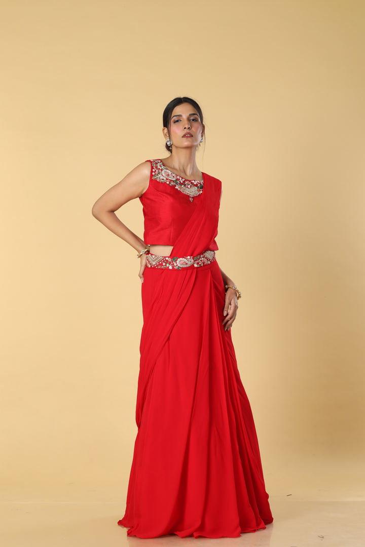 Red D-dupion resham embroidered blouse paired with georgette skirt  and embroidered banarasi bandhej cape